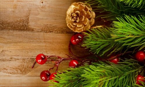 christmas-time-with-conifer-cone-balls-decorations-on-wooden-background-header-hd-1920x720